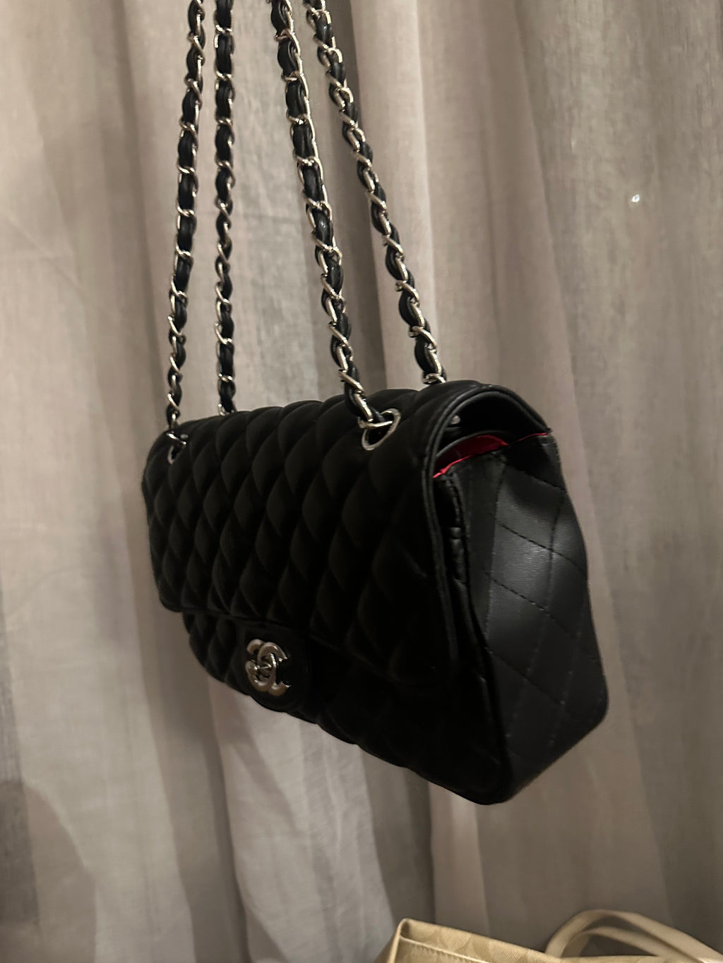 Black quilted shoulder bag with silver-tone hardware