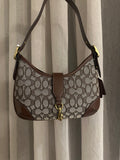 Signature jacquard canvas in a beige/taupe and brown pattern